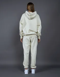 Back view of a heavyweight cream fleece hoodie and jogger pants set for women