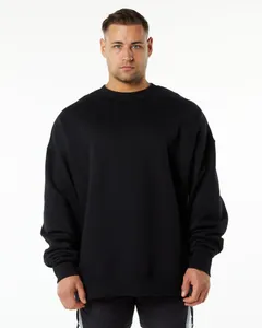 Close-up detail of heavy 400g black crewneck sweatshirt with loose dropped shoulder fit