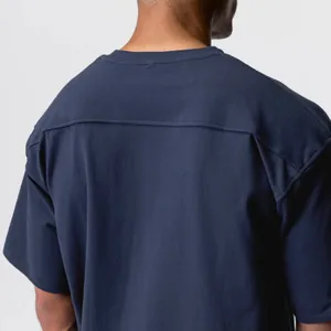 Detailed back view of navy blue cotton sports T-shirt showing seam construction
