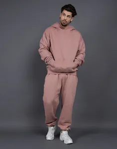 Oversized mauve fleece hoodie and sweatpants set on model for a stylish casual look