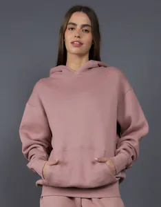 Front view of an oversized 400g mauve heavyweight fleece hoodie on a female model