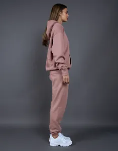 Side view of oversized dusty rose fleece hoodie and matching sweatpants set