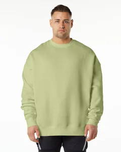 Front view of an oversized olive green fleece sweatshirt on a male model.