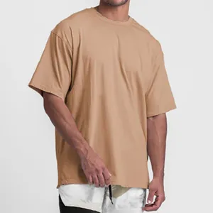 Relaxed fit men's oversized tan cotton t-shirt featuring a split hem for sports