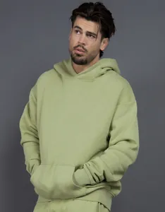 Detail of a sage green 400G heavyweight oversized fleece hoodie with drop shoulders.