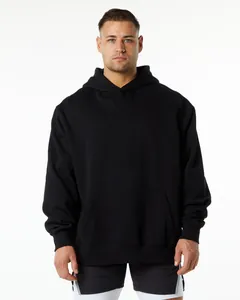 Front view detail of a men's heavyweight loose black solid color hooded sweatshirt