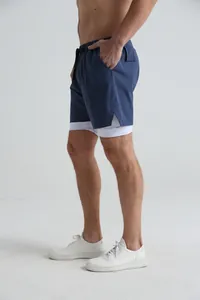 Side view of men's navy blue 2-in-1 sports shorts for fitness and running