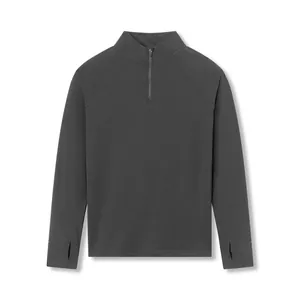Front view of dark gray half-zip sports top with thumbhole details