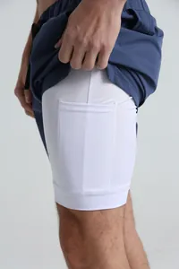 Detail of 2-in-1 sports shorts showing white inner liner with a built-in phone pocket
