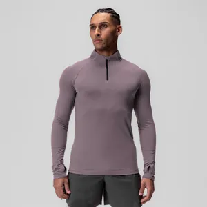 Men's half-zip compression long sleeve sports top in mauve with athletic fit for gym.