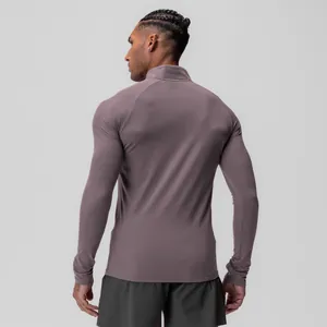 Back view of a men's purple long-sleeve compression shirt designed for fitness and sports.
