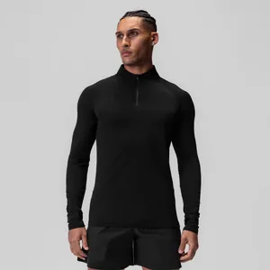 Front view of a men's black athletic half-zip compression long sleeve top for gym training