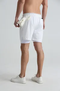 Back view of white double-layered men's sports shorts featuring quick-dry fabric and liner