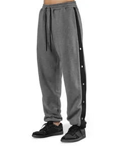 Pantaloni sportivi grigi da uomo con striscia laterale nera e bottoni a scatto