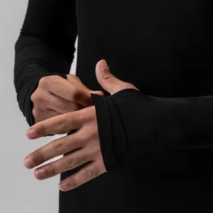 Close-up of black long-sleeved compression top with thumbhole cuff detail for men