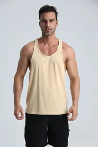 Front view of a muscular man wearing a beige breathable racerback sports tank top