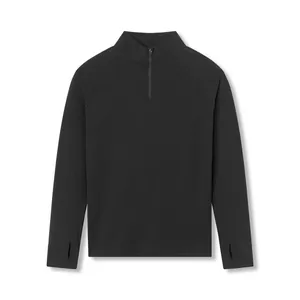 Front view of black men's half-zip sports top with thumbholes and quick-dry fabric.