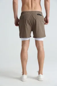 Rear view detail of brown men's double-layer sports shorts with white inner lining