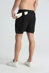 Close-up detail showing the functional back towel loop on black quick-dry sports shorts