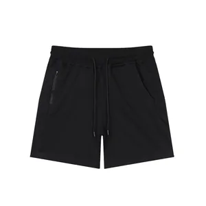 Detailed view of men's black athletic shorts featuring drawstring and side zipper pocket