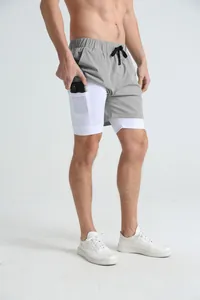 Men's grey 2-in-1 running shorts with inner phone pocket and quick-dry compression liner.