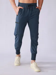 Front view of men's navy blue quick-dry sports cargo pants with multiple zipper pockets