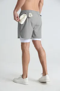 Back view of men's 2-in-1 running shorts in grey with a convenient towel holder