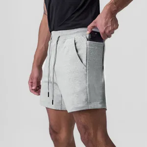 Detailed view of grey men's athletic shorts featuring a convenient side phone pocket