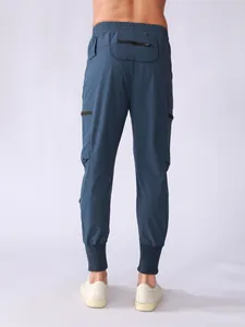 Detailed back view of men's navy blue quick-dry cargo joggers with zip pockets