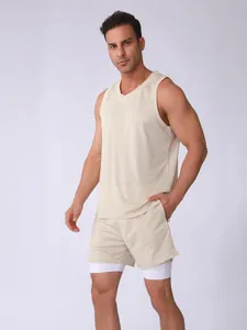 Detailed view of men's breathable mesh sports tank top and double-layer shorts set in beige