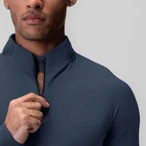 Close-up of the quarter-zip collar on a men's navy blue athletic compression top.