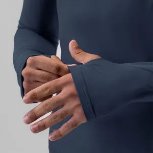 Macro view of navy blue men's sports compression shirt showing thumbhole cuff design