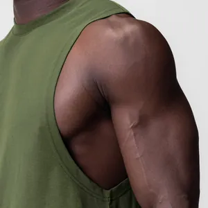 Close-up of olive green fitness tank top showing armhole detail and fabric texture