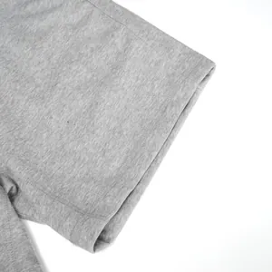 Close-up detail of gray cotton sports shorts showing high-quality stitching and fabric texture