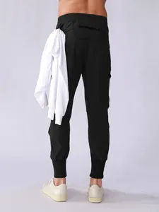 Detailed rear view of men's black quick-dry athletic cargo joggers with pockets and tapered cuffs