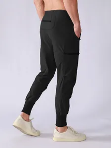 Back view detail of men's quick-dry black athletic cargo joggers with multi-pockets