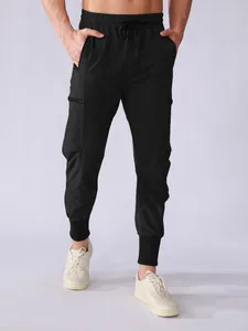 Men's black quick-dry cargo joggers with multi-pockets and a drawstring waist for training.