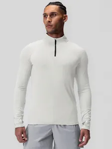 Men's dry-fit half-zip athletic compression shirt for fitness and gym workouts.