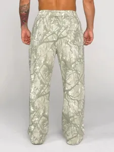 Back view detail of men's loose jogging pants with realistic forest branch pattern