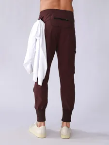 Rear view of men's maroon quick-dry cargo joggers showing pockets and fabric detail