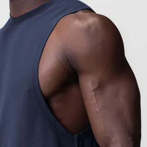 Detail view of navy blue men fitness tank top showing wide armhole and fabric texture