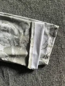 Detail view of mens digital forest camo jogger pants showing cuff stitching detail