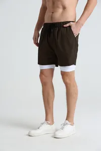 Detail of men's quick-dry double-layer athletic shorts in brown and white