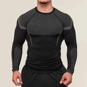 Close-up detail of men's compression long-sleeve gym shirt with grey mesh panels