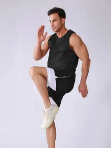 Dynamic action shot of men's black mesh tank top and double-layer sports shorts set