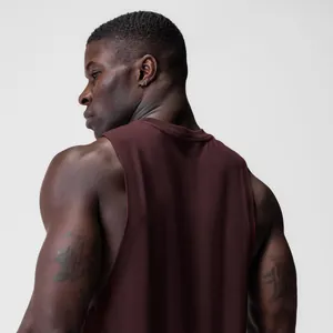 Detail view of maroon men's gym tank top featuring wide armholes and premium fabric.