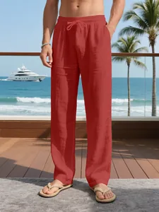 Men's relaxed fit linen drawstring pants in terracotta, perfect for summer beach holidays.