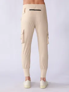 Detailed rear view of beige men's quick-dry sports cargo pants with zip pockets