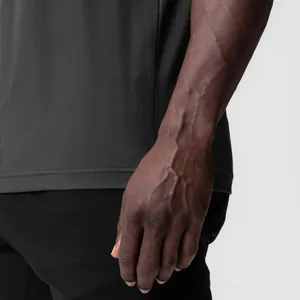 Close-up of black ice-feel fitness tank top showing premium fabric texture and hem detail.