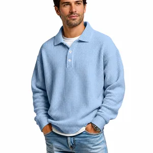 Close-up of light blue waffle knit polo shirt showing refined texture and collar details